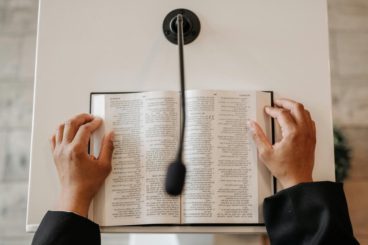 Photo by Pavel Danilyuk: http://www.pexels.com/photo/person-standing-behind-a-podium-with-a-bible-8815042/